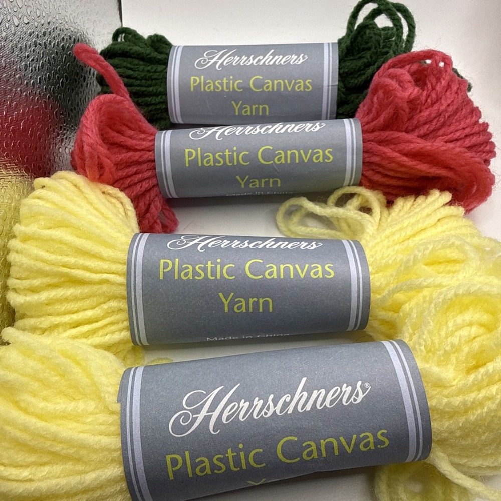 4 Skeins 25 Yard Herrschners Plastic Canvas Yarn. 2 Yellow 1 Rose 1 Hunter